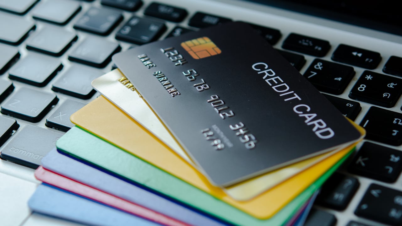 pile of credit card on a keyboard