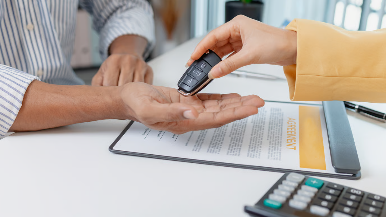 A man is financing the purchase of his new car