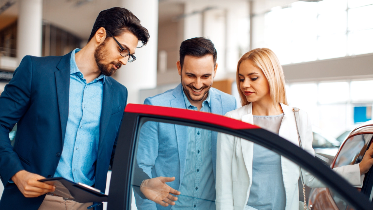young couple shopping for a car