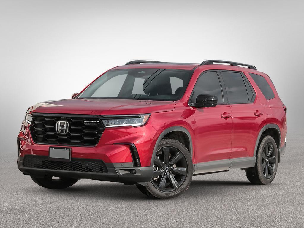 Honda Pilot Black Edition 2025 rouge, vue de face côté conducteur, stationné à l’extérieur