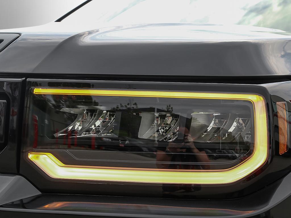 2026 Honda Passport TrailSport AWD in black, close-up of front headlight