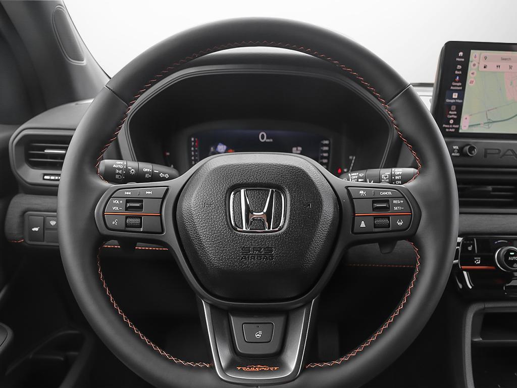 2026 Honda Passport TrailSport AWD in black, close-up of steering wheel