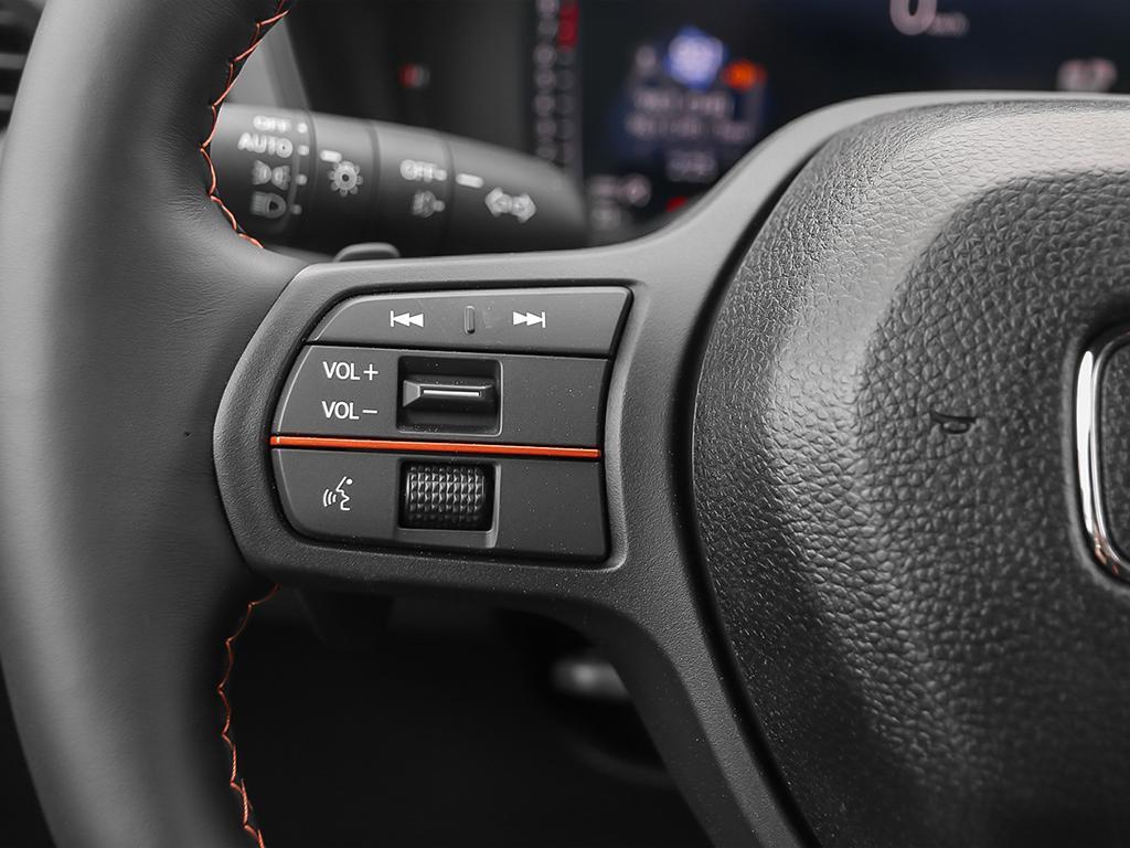2026 Honda Passport TrailSport AWD in black, close-up of audio controls on left side of steering wheel
