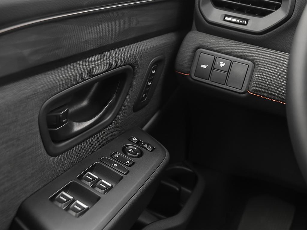 2026 Honda Passport TrailSport AWD in black, power window panel on driver’s door