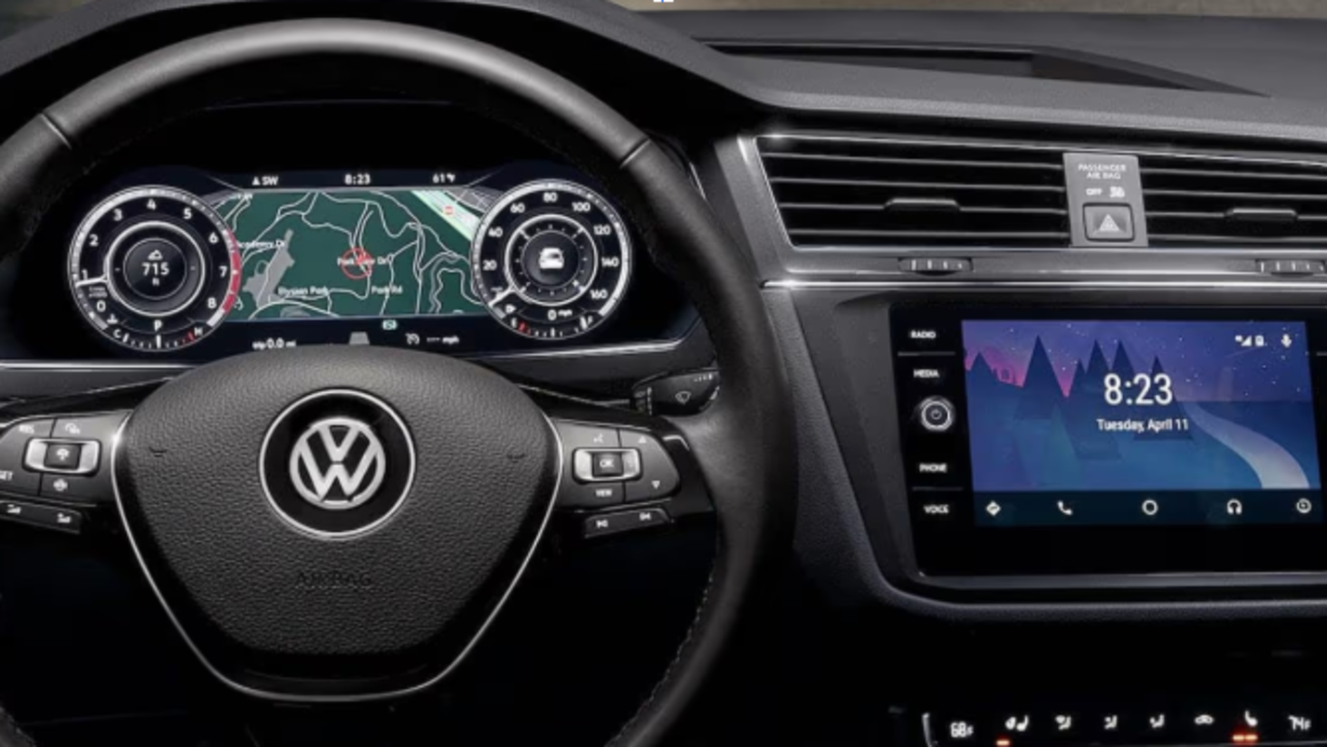 Volkswagen car interior dashboard and steering wheel with digital instrument cluster and touchscreen display