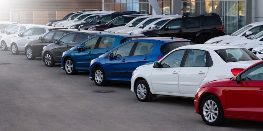 Cars lined up outside at a car dealership